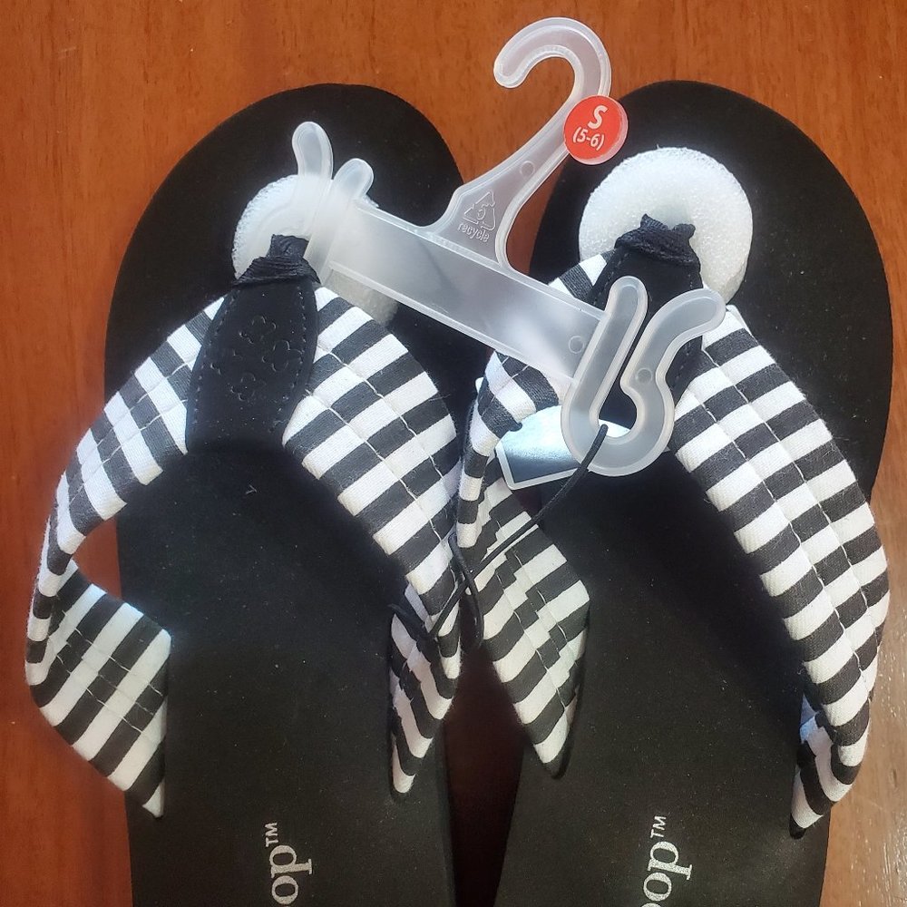 Ladies West Loop, black and white striped flip-flops. Size 5/6.